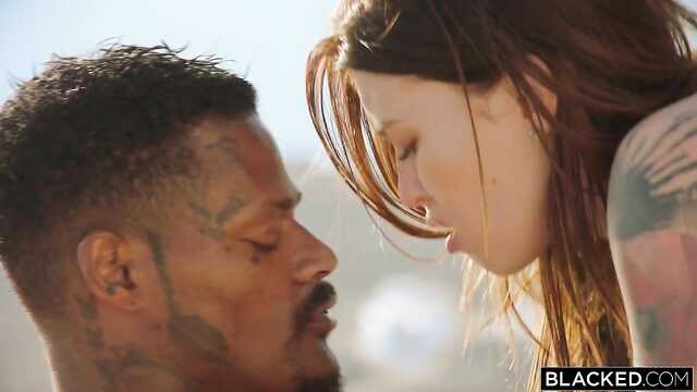 Black rope of a Negro in the mouth of a cute brown-haired woman