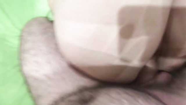 An excited wife jerks off a cock in oil and then jumps on it