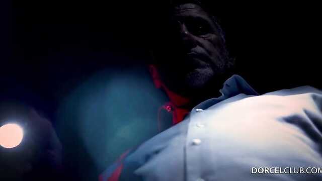 Under the light of lanterns gives a point to a crowd of men