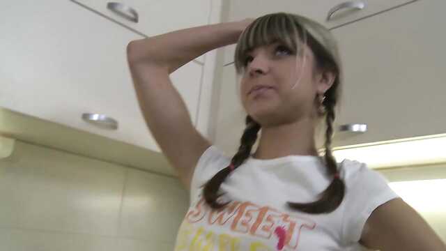 Cutie in the kitchen fucks herself with a yellow banana