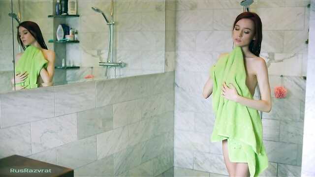 Erotic showering of one skinny model on camera